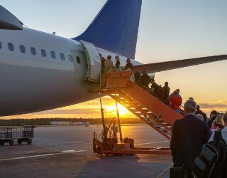 airline passengers entering plane